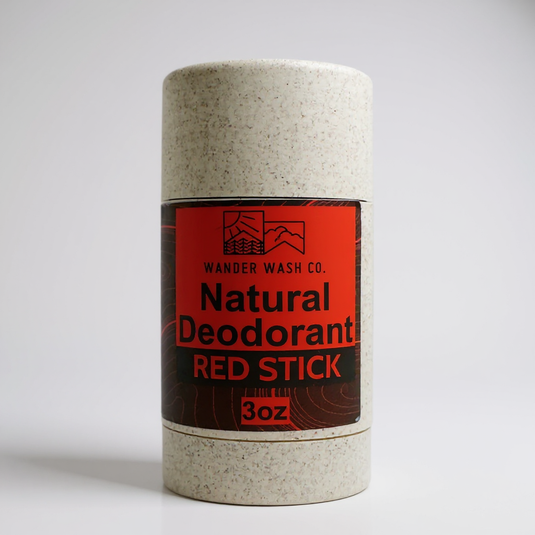 Wander Wash Co. Red Stick natural deodorant in a speckled wheat straw tube with a red and black label, 3 oz