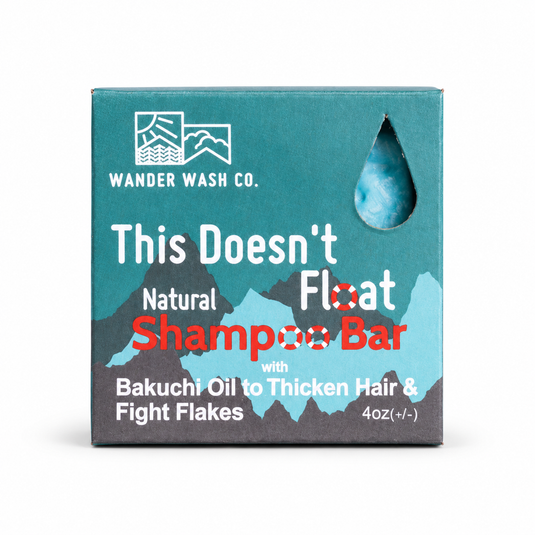 Picture of Wander Wash Co's This Doesn't Float Shampoo Bar inside its Blue teal square box.